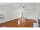 Living room featuring hardwood floors, vaulted ceiling and French doors at 10423 Brawley Ln, Charlotte, NC 28215