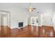 Bright living room features a fireplace, hardwood floors, and an open layout at 10423 Brawley Ln, Charlotte, NC 28215