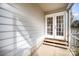 Screened porch with French doors and wooden steps at 10423 Brawley Ln, Charlotte, NC 28215