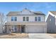 Two-story home with brick facade, attached garage, and landscaped yard at 2036 White Cypress Ct # Kh10, Charlotte, NC 28216