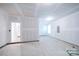 Unfinished garage with open space and access to a closet at 2036 White Cypress Ct # Kh10, Charlotte, NC 28216