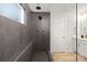 Large walk-in shower with multiple shower heads and dark tile at 2036 White Cypress Ct # Kh10, Charlotte, NC 28216