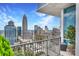 Enjoy city views from this cozy balcony space with comfortable seating at 215 N Pine St # 3705, Charlotte, NC 28202