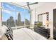 Modern bedroom featuring a city view, ceiling fan, and dark dresser with a decorative mirror at 215 N Pine St # 3705, Charlotte, NC 28202