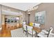Dining room connected to the kitchen with hardwood floors and ample lighting at 215 N Pine St # 3705, Charlotte, NC 28202