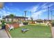 Outdoor lawn game area with seating, landscaping, and other yard games at 215 N Pine St # 3705, Charlotte, NC 28202
