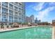Rooftop pool offers city views and lounge areas for residents to relax and socialize at 215 N Pine St # 3705, Charlotte, NC 28202