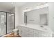 Modern bathroom featuring double sinks, a glass shower, and brushed gold hardware at 5840 Pittmon Ln, Kannapolis, NC 28081