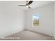 Bright bedroom featuring a ceiling fan, neutral carpet, and a bright window at 5840 Pittmon Ln, Kannapolis, NC 28081