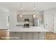 Contemporary kitchen with a large island, pendant lights, and stainless-steel appliances at 5840 Pittmon Ln, Kannapolis, NC 28081