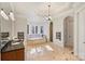 Elegant bathroom with soaking tub, walk-in shower, and granite vanity at 13824 Claysparrow Rd, Charlotte, NC 28278