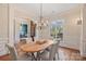 Formal dining room with oval table and chandelier at 13824 Claysparrow Rd, Charlotte, NC 28278