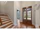 Bright entryway with hardwood floors and views to the backyard at 13824 Claysparrow Rd, Charlotte, NC 28278