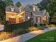 Elegant two-story home with stone accents and landscaping at 13824 Claysparrow Rd, Charlotte, NC 28278