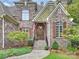 Inviting home entry with stone facade and double doors at 13824 Claysparrow Rd, Charlotte, NC 28278