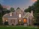 Stunning stone and shingle two-story home with landscaping at 13824 Claysparrow Rd, Charlotte, NC 28278