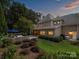 House exterior showcasing backyard patio and landscaping at 13824 Claysparrow Rd, Charlotte, NC 28278