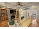 Living room boasts a stone fireplace, built-in shelving, and hardwood floors at 13824 Claysparrow Rd, Charlotte, NC 28278