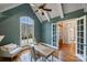 Bright home office with built-ins and views of the backyard at 13824 Claysparrow Rd, Charlotte, NC 28278