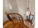 Ornate staircase with wooden railing and wrought iron accents at 13824 Claysparrow Rd, Charlotte, NC 28278