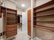 Large walk-in closet with ample shelving and drawers at 13824 Claysparrow Rd, Charlotte, NC 28278