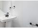 Bathroom featuring pedestal sink, matte black hardware, and gray walls at 1609 Blanche St, Charlotte, NC 28262