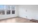 Bright living room with large windows, hardwood flooring, and plenty of natural light at 1609 Blanche St, Charlotte, NC 28262