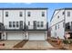 Modern townhome exterior featuring a two-car garage and balcony on the second floor at 1617 Blanche St, Charlotte, NC 28262