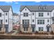 Row of new construction townhomes with neutral siding, brick accents, and professionally landscaped yards at 1617 Blanche St, Charlotte, NC 28262