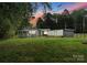 House exterior with a detached shed and large backyard at 217 Burrage Ne Rd, Concord, NC 28025