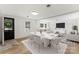 Entryway with black front door, and views into living and dining area at 217 Burrage Ne Rd, Concord, NC 28025