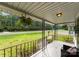 Front porch with wrought iron railing and hanging planters at 217 Burrage Ne Rd, Concord, NC 28025