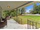 Front porch with wrought iron railing and hanging planters at 217 Burrage Ne Rd, Concord, NC 28025