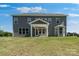 Expansive backyard with covered patio, showcasing an ideal space for outdoor entertaining at 5735 Allburn Pkwy, Concord, NC 28027