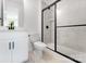 Stylish bathroom featuring walk-in shower with black hardware and a white vanity at 5735 Allburn Pkwy, Concord, NC 28027