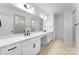 Bathroom with dual sink vanity, modern fixtures and a large mirror at 5735 Allburn Pkwy, Concord, NC 28027