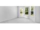 Well-lit bedroom featuring bay windows and neutral carpeting, perfect for relaxation at 5735 Allburn Pkwy, Concord, NC 28027