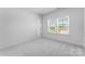 Cozy bedroom with plush carpeting and bright window at 5735 Allburn Pkwy, Concord, NC 28027