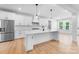 Spacious kitchen with stainless steel refrigerator and a large island at 5735 Allburn Pkwy, Concord, NC 28027