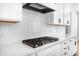 Modern kitchen with white subway tile backsplash and a gas stovetop at 5735 Allburn Pkwy, Concord, NC 28027