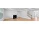 Bright living room with a fireplace, white trim and large window at 5735 Allburn Pkwy, Concord, NC 28027