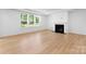 Large living room with fireplace and plenty of natural light at 5735 Allburn Pkwy, Concord, NC 28027