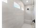 Modern shower with sleek tile, shower bench and contemporary fixtures at 5735 Allburn Pkwy, Concord, NC 28027