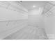 Walk-in closet with ample shelving and carpeted flooring at 5735 Allburn Pkwy, Concord, NC 28027