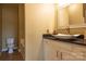 Clean bathroom with white vanity, vessel sink, and copper fixtures at 11770 Redbridge Blvd, Locust, NC 28097