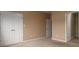 Spacious bedroom with neutral walls, carpet, and double doors to closet at 11770 Redbridge Blvd, Locust, NC 28097