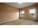 Bright bedroom with neutral walls, carpet, and two large windows at 11770 Redbridge Blvd, Locust, NC 28097