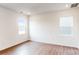 Bright bedroom with hardwood floors and two windows at 2074 Van Buren Rd, Sherrills Ford, NC 28673