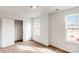 Well-lit bedroom with double door closet and carpet flooring at 2074 Van Buren Rd, Sherrills Ford, NC 28673