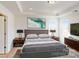 Spacious bedroom with large windows, a comfortable bed, and modern nightstands at 2074 Van Buren Rd, Sherrills Ford, NC 28673